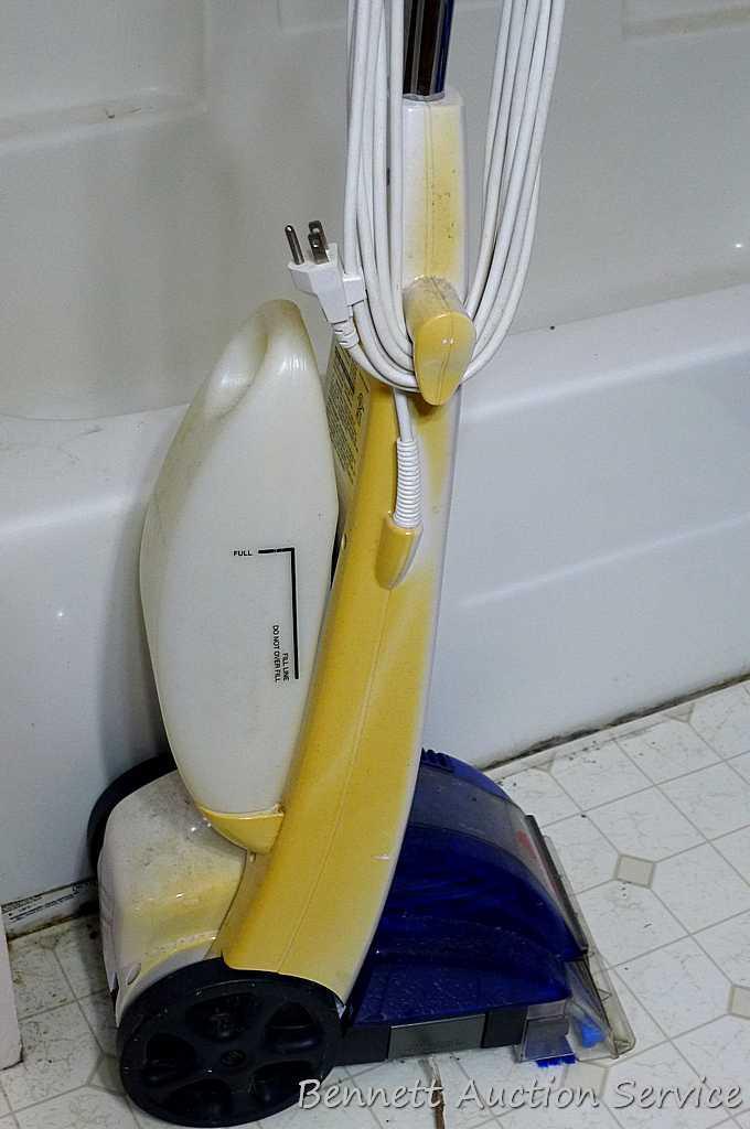 Bissell Quick Steamer Plus is 44" tall. Runs.