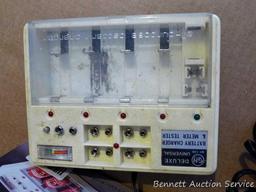 Universal Battery Tester and Charger; measures 5-1/2" x 7" x 2". Lights up.