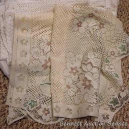 Lacy tablecloths, valances and curtain panels. 5-1/2' x 20" valance; 6' diameter table cloth; more.