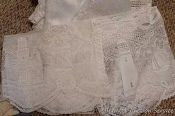 Lacy tablecloths, valances and curtain panels. 5-1/2' x 20" valance; 6' diameter table cloth; more.