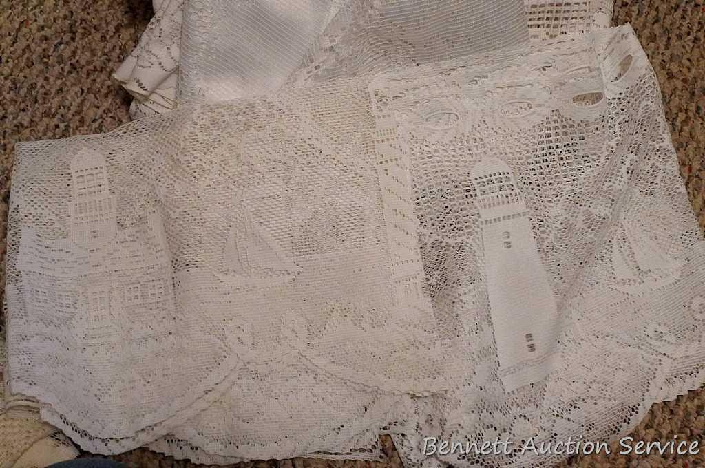 Lacy tablecloths, valances and curtain panels. 5-1/2' x 20" valance; 6' diameter table cloth; more.
