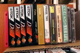 Fitness VHS tapes, plus some cassette tapes - some blank and new, some Christmas music, etc.;