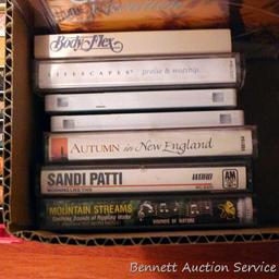 Fitness VHS tapes, plus some cassette tapes - some blank and new, some Christmas music, etc.;