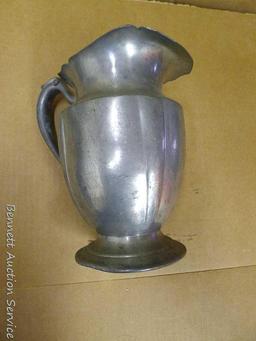 Pewter Paul Revere pitcher is 8-1/2" tall; other pewter pitcher has a cork stopper in spout;