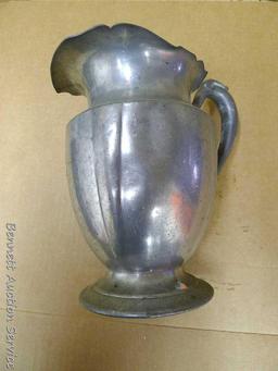 Pewter Paul Revere pitcher is 8-1/2" tall; other pewter pitcher has a cork stopper in spout;