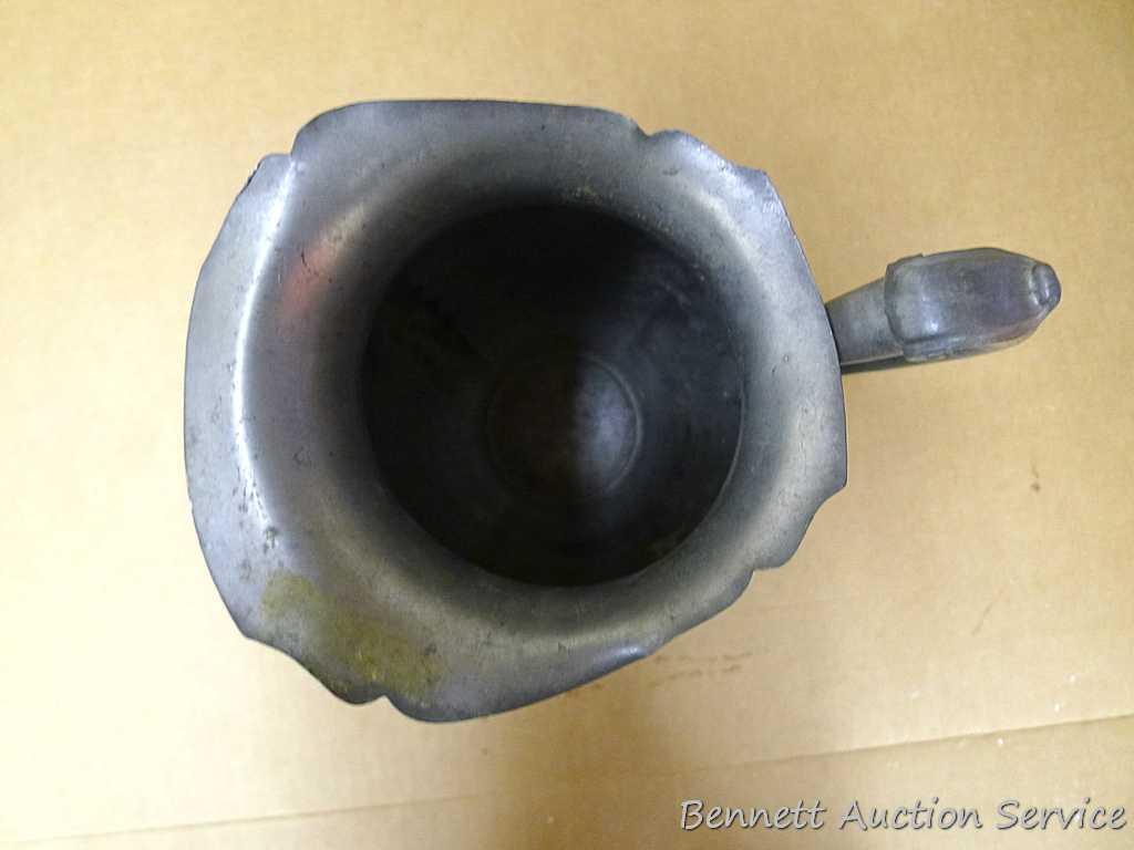 Pewter Paul Revere pitcher is 8-1/2" tall; other pewter pitcher has a cork stopper in spout;
