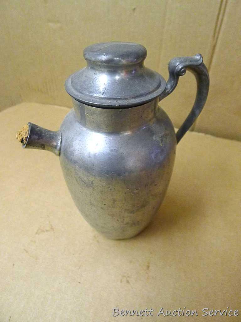 Pewter Paul Revere pitcher is 8-1/2" tall; other pewter pitcher has a cork stopper in spout;