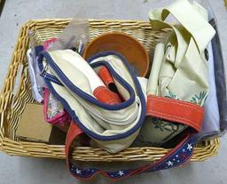 18" wide wicker basket filled with assorted cloth shopping bags, curtains, clay pot, etc.