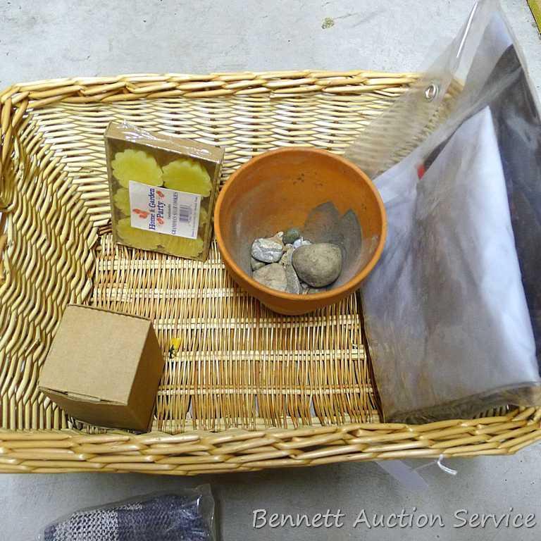 18" wide wicker basket filled with assorted cloth shopping bags, curtains, clay pot, etc.