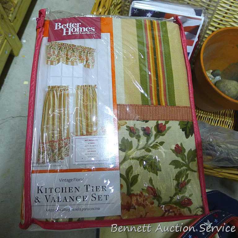 18" wide wicker basket filled with assorted cloth shopping bags, curtains, clay pot, etc.