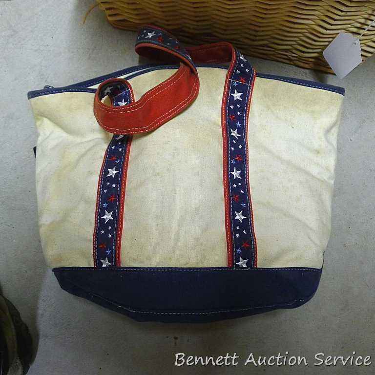 18" wide wicker basket filled with assorted cloth shopping bags, curtains, clay pot, etc.