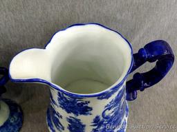 Beautiful decorative vase, oil lamp and music box; pitcher measures 9-1/2" x 9" tall. The 3 pieces