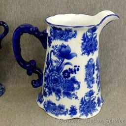 Beautiful decorative vase, oil lamp and music box; pitcher measures 9-1/2" x 9" tall. The 3 pieces