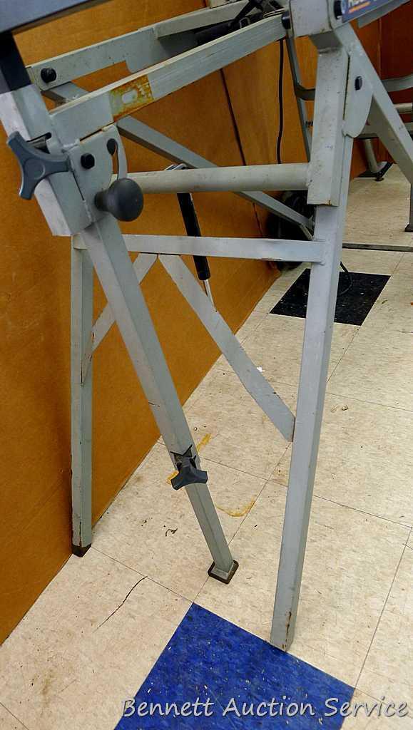 DeWalt 12" double bevel sliding compound miter saw is 36" long. It is bolted to a Ridgid AC9940