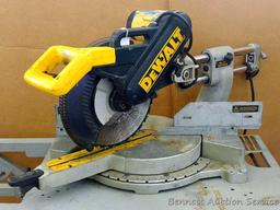 DeWalt 12" double bevel sliding compound miter saw is 36" long. It is bolted to a Ridgid AC9940