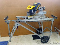 DeWalt 12" double bevel sliding compound miter saw is 36" long. It is bolted to a Ridgid AC9940