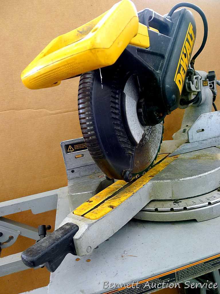 DeWalt 12" double bevel sliding compound miter saw is 36" long. It is bolted to a Ridgid AC9940