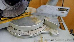 DeWalt 12" double bevel sliding compound miter saw is 36" long. It is bolted to a Ridgid AC9940