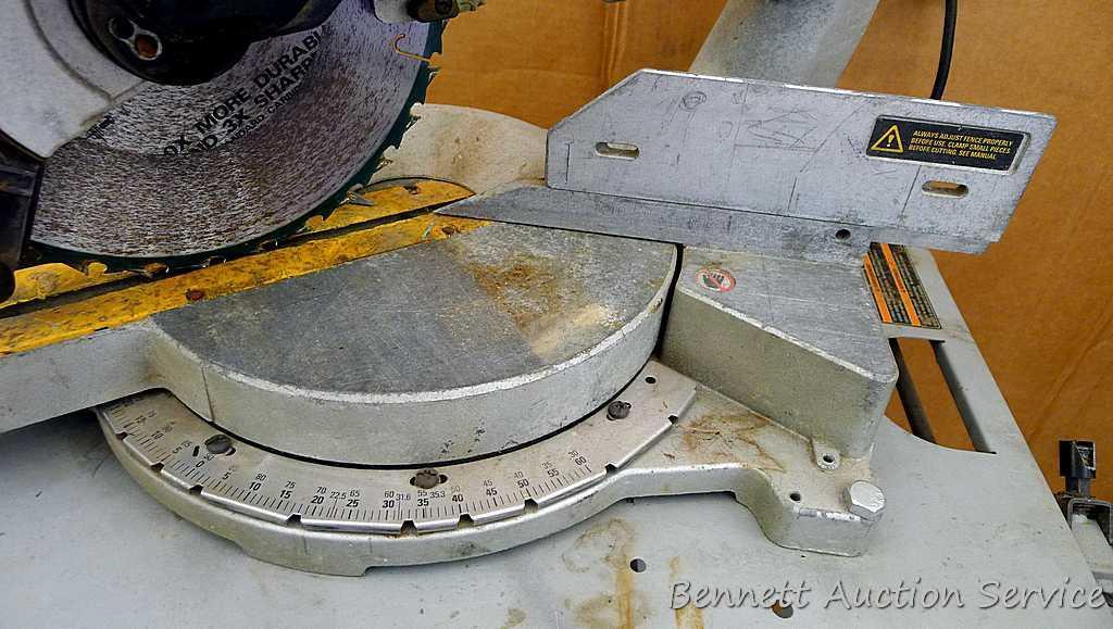 DeWalt 12" double bevel sliding compound miter saw is 36" long. It is bolted to a Ridgid AC9940
