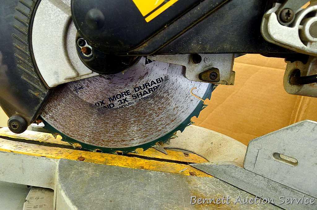 DeWalt 12" double bevel sliding compound miter saw is 36" long. It is bolted to a Ridgid AC9940