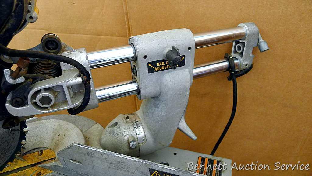 DeWalt 12" double bevel sliding compound miter saw is 36" long. It is bolted to a Ridgid AC9940