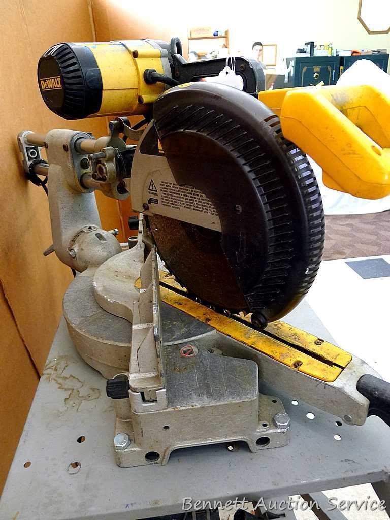 DeWalt 12" double bevel sliding compound miter saw is 36" long. It is bolted to a Ridgid AC9940