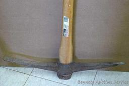 Master Mechanic 36" pick axe with hickory handle. Blade is 22-1/2" long.