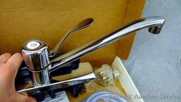 Moen single handle chrome kitchen faucet with hose spray #87130.