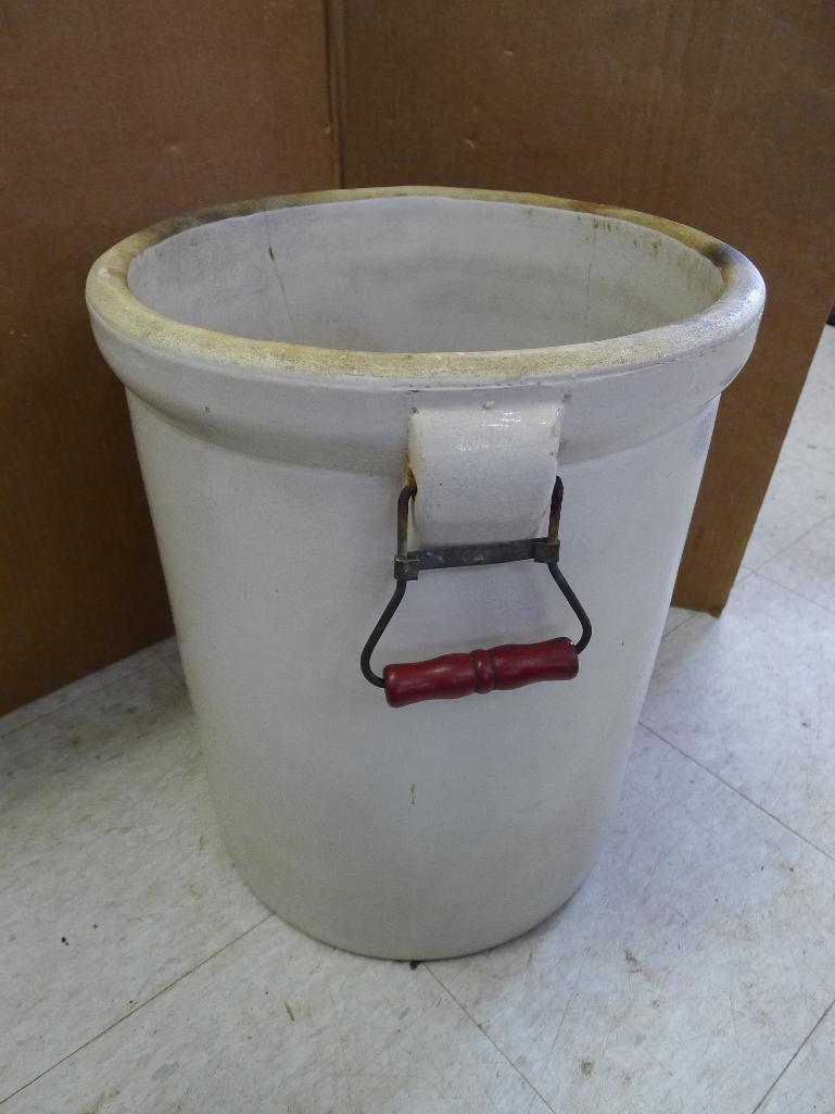 Antique blue crown 8 gallon crock with handles; measures 14' X 17". Has crazing, chip near handle,