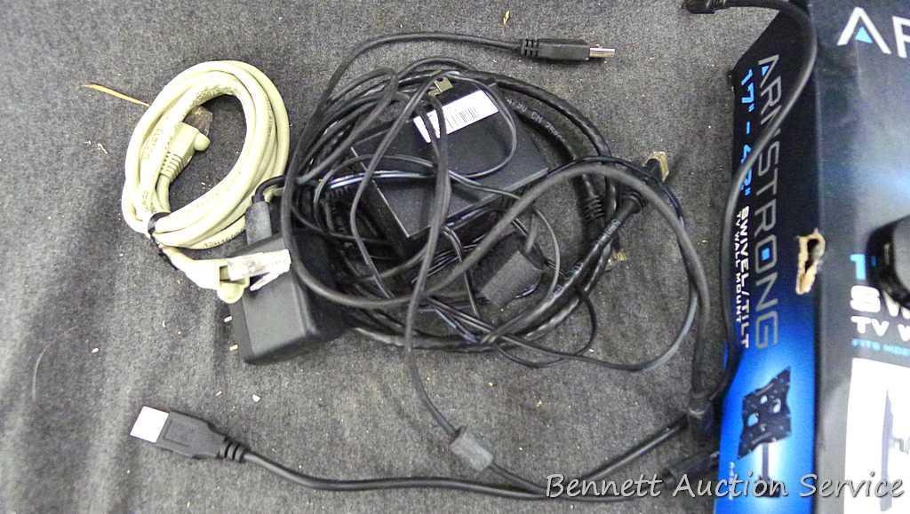 Sony Play Station 4, Armstrong 17"-42" swivel TV wall mount, and a bag of cords. PS4 turns on and is
