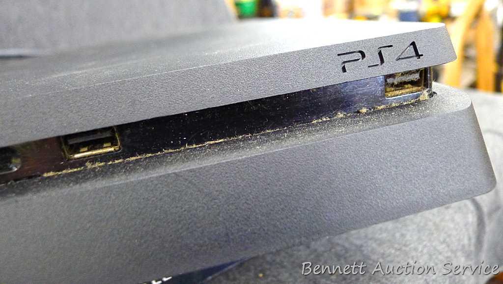 Sony Play Station 4, Armstrong 17"-42" swivel TV wall mount, and a bag of cords. PS4 turns on and is