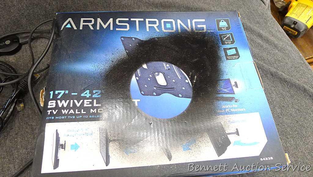 Sony Play Station 4, Armstrong 17"-42" swivel TV wall mount, and a bag of cords. PS4 turns on and is