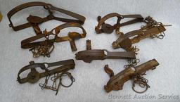 Five Victor cast jaw traps including numbers 0, 1, 1-1/2 single spring traps; Plus another similar