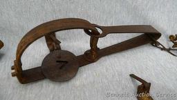 Five Victor cast jaw traps including numbers 0, 1, 1-1/2 single spring traps; Plus another similar