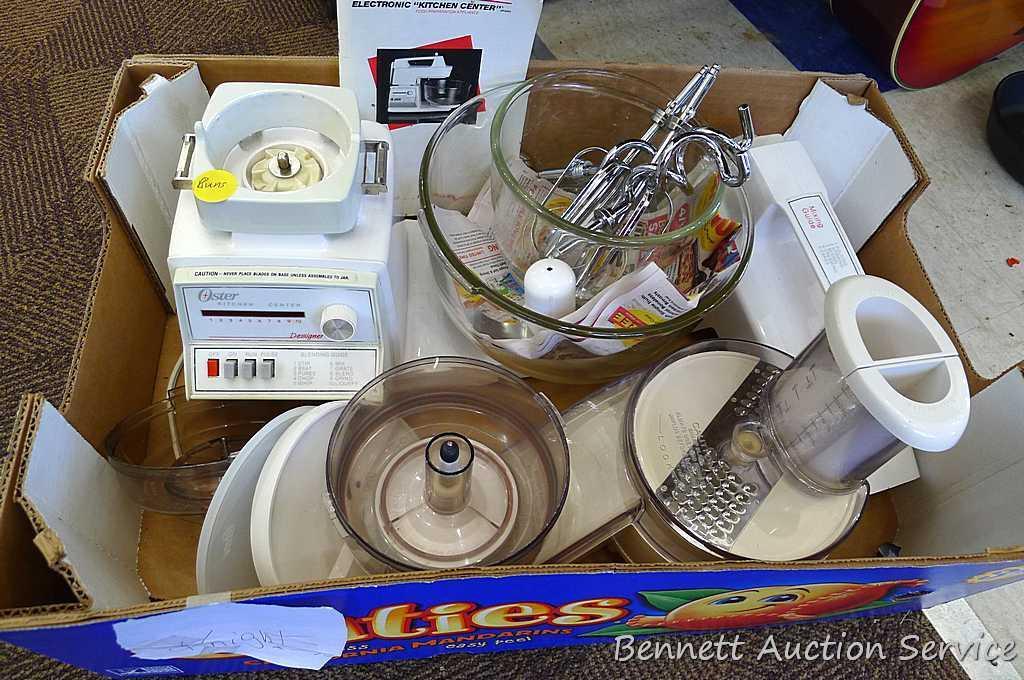 Oster "Kitchen Center" includes base, two bowls, beaters, mixer head, food processor head, and more.