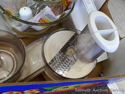 Oster "Kitchen Center" includes base, two bowls, beaters, mixer head, food processor head, and more.