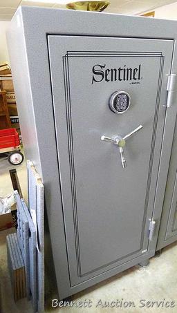 Sentinel electronic combination gun safe by Stack On comes with a key, door mounted handgun sleeve