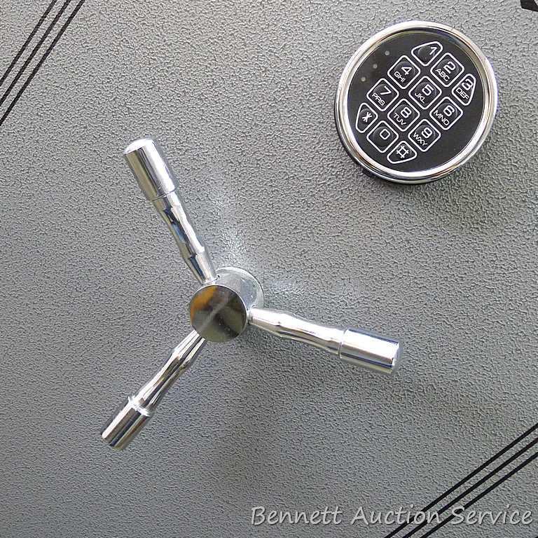 Sentinel electronic combination gun safe by Stack On comes with a key, door mounted handgun sleeve