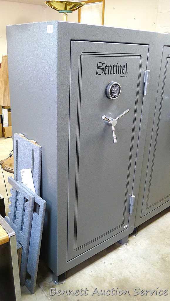 Sentinel electronic combination gun safe by Stack On comes with a key, door mounted handgun sleeve
