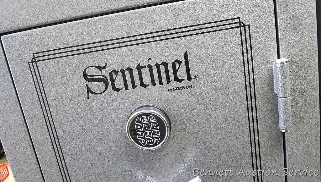 Sentinel electronic combination gun safe by Stack On comes with a key, door mounted handgun sleeve