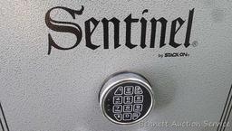 Sentinel electronic combination gun safe by Stack On comes with a key, door mounted handgun sleeve