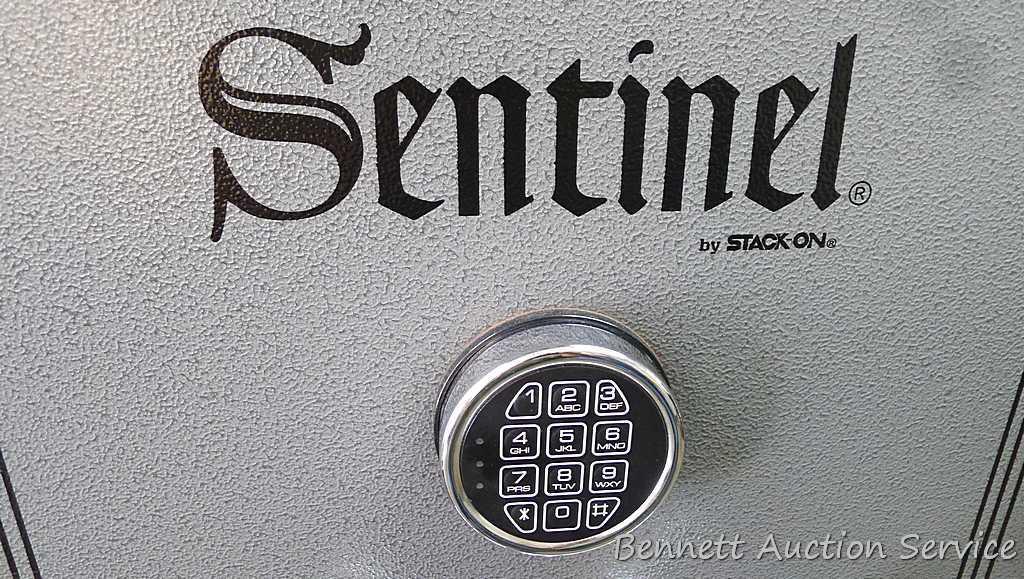 Sentinel electronic combination gun safe by Stack On comes with a key, door mounted handgun sleeve