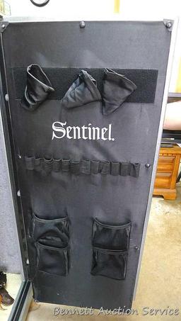 Sentinel electronic combination gun safe by Stack On comes with a key, door mounted handgun sleeve