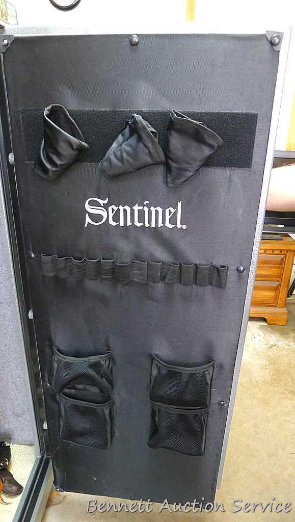 Sentinel electronic combination gun safe by Stack On comes with a key, door mounted handgun sleeve