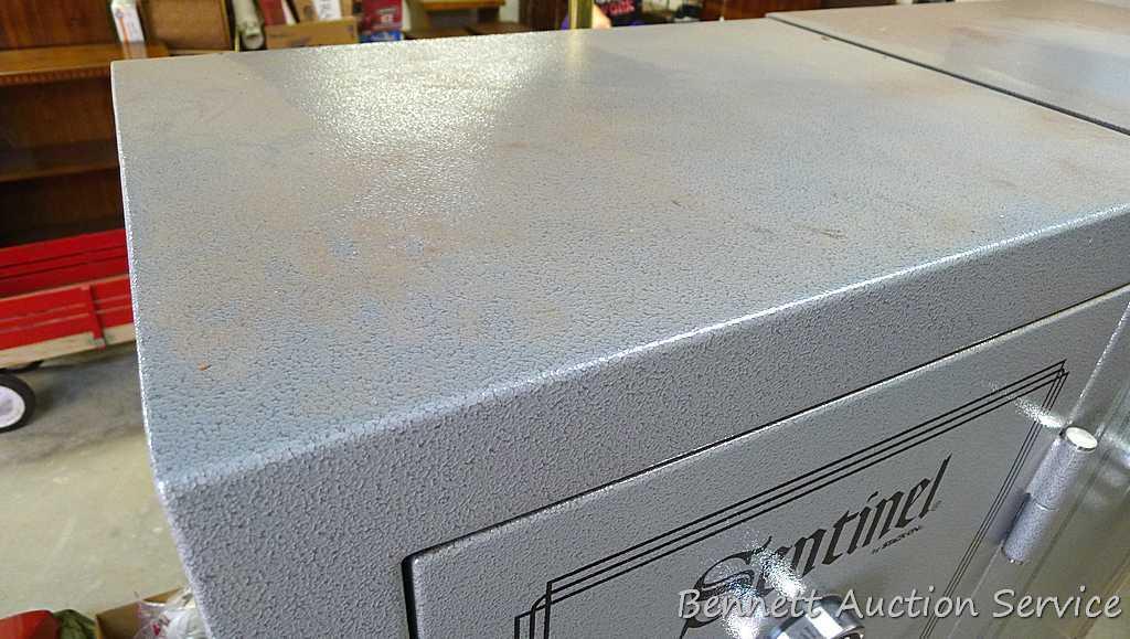Sentinel electronic combination gun safe by Stack On comes with a key, door mounted handgun sleeve