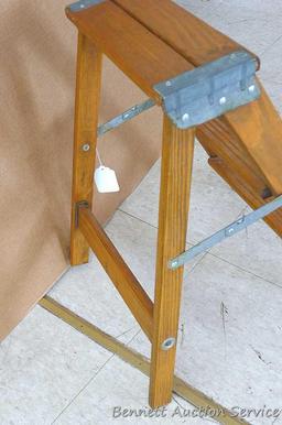 Nice sturdy folding step stool.12-1/2" x 22-1/2" tall.