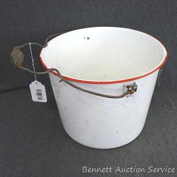 Red and white enameled would look great full of flowers or balsam branches for Christmas. Has a