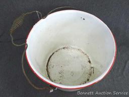 Red and white enameled would look great full of flowers or balsam branches for Christmas. Has a