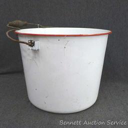 Red and white enameled would look great full of flowers or balsam branches for Christmas. Has a