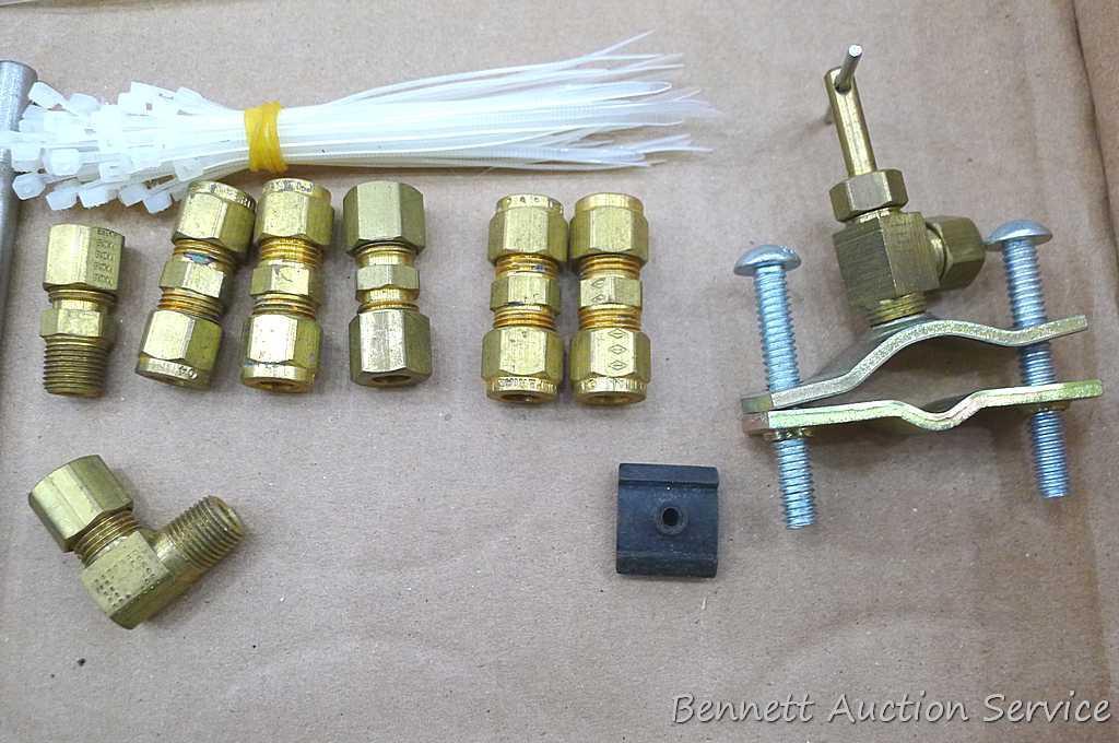 Self tapping saddle valve, zip ties, wire, saddle clamp, and copper tubing connectors. Longest zip